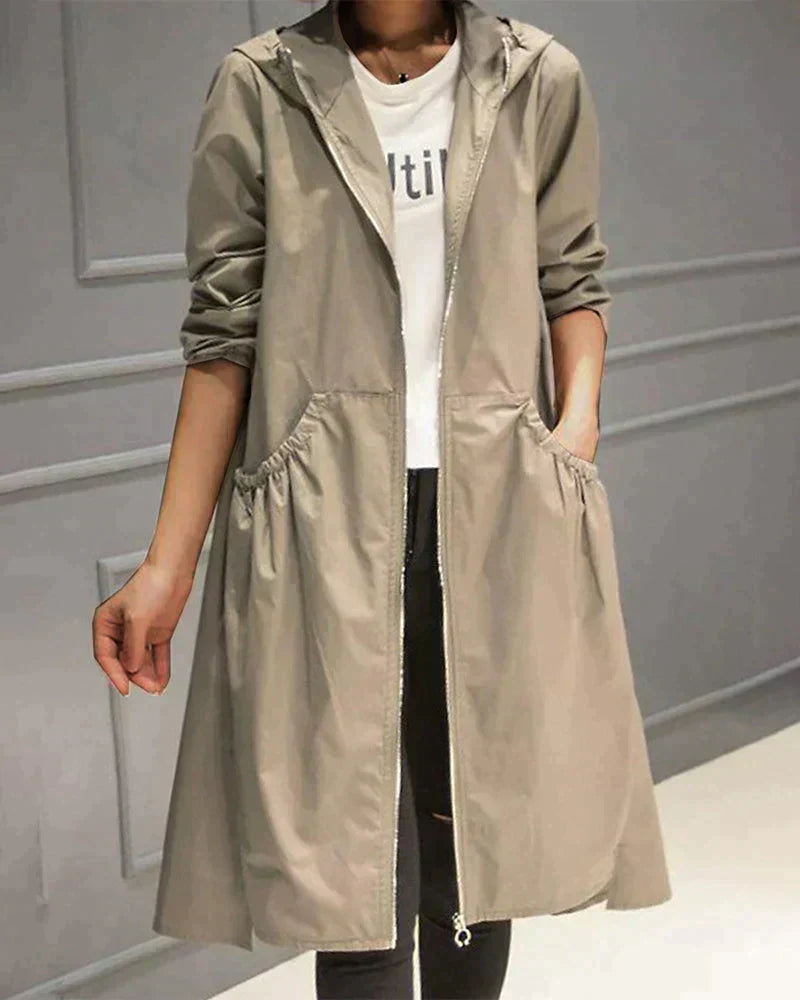 Stylish women's lightweight waterproof rain jacket with hood, perfect for spring/fall weather protection.