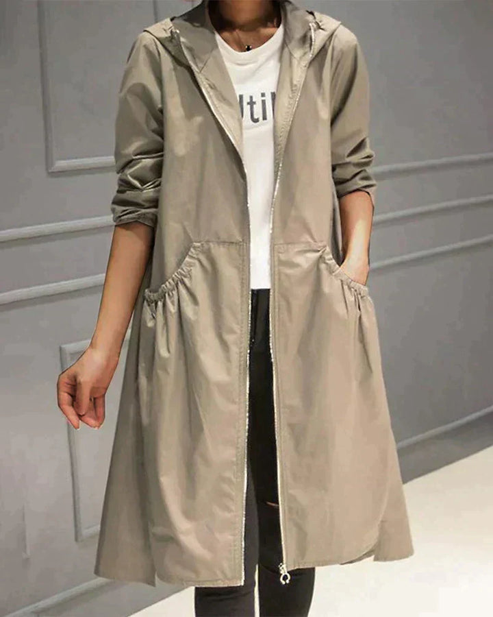 Stylish women's lightweight waterproof rain jacket with hood, perfect for spring/fall weather protection.