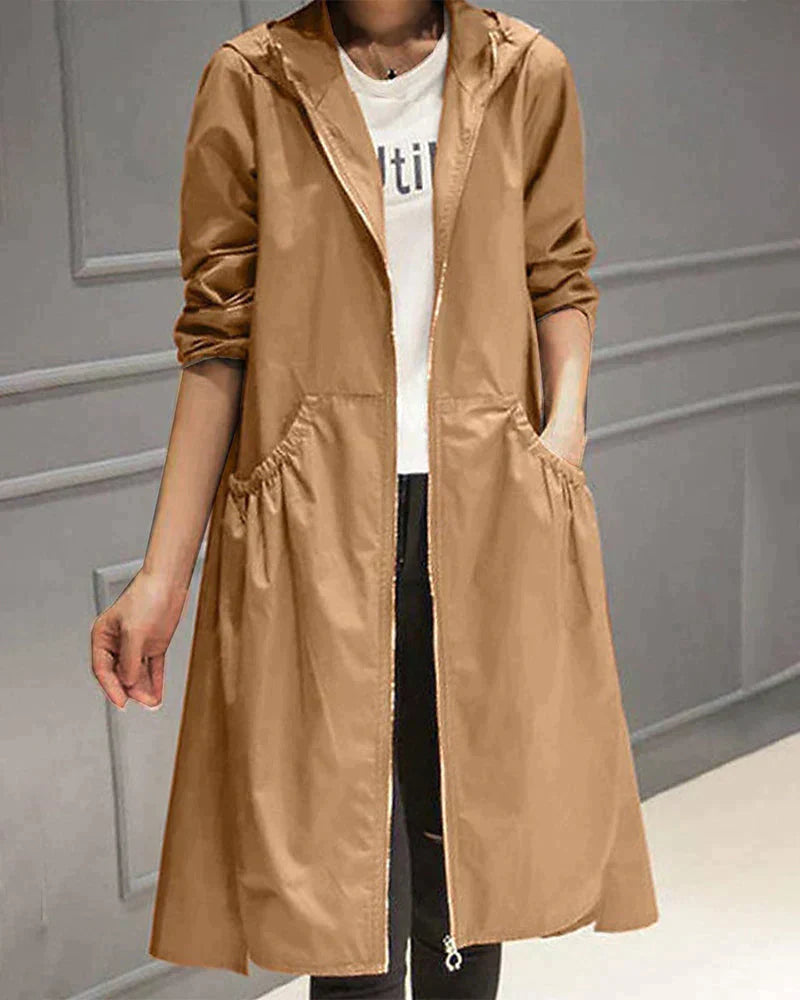 Relaxed fit women's rain jacket, knee-length for optimal coverage & comfort in wet conditions.