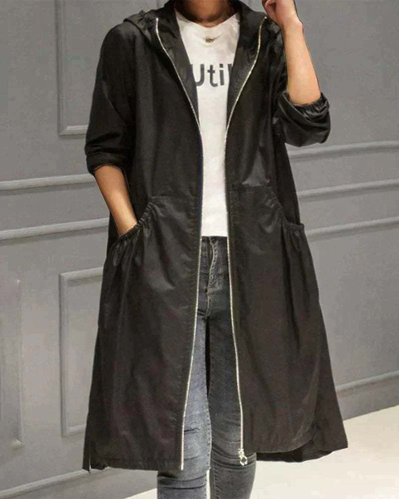 Women's hooded windbreaker rain jacket, waterproof & lightweight, designed for outdoor activities.