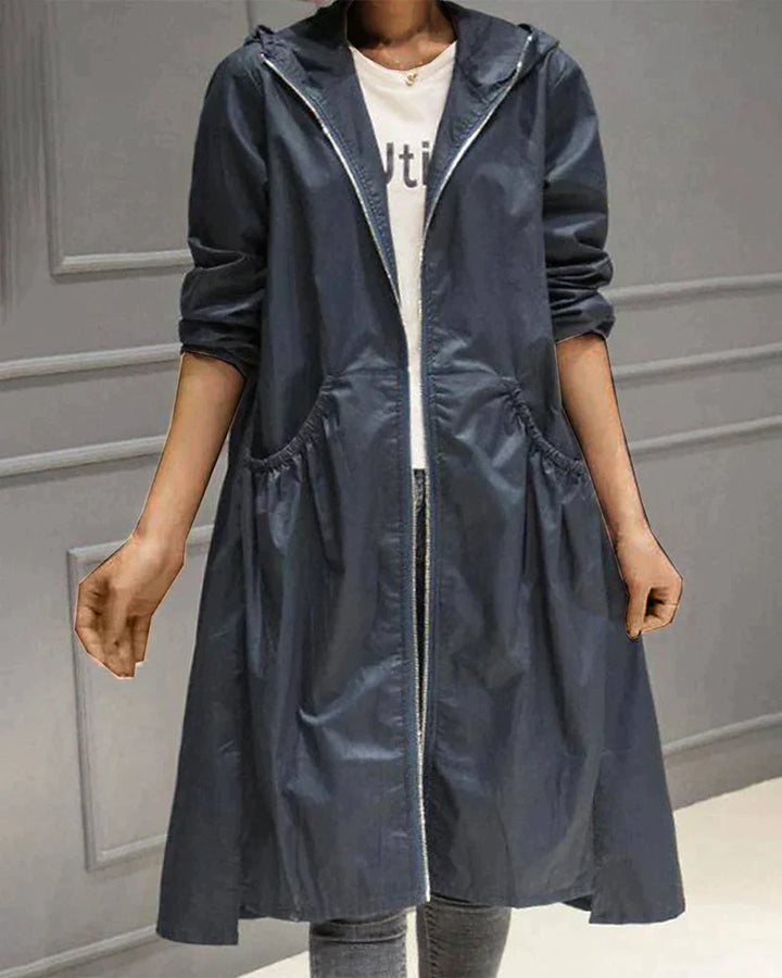 Practical women's all-weather rain jacket, knee-length with an adjustable hood & relaxed silhouette.