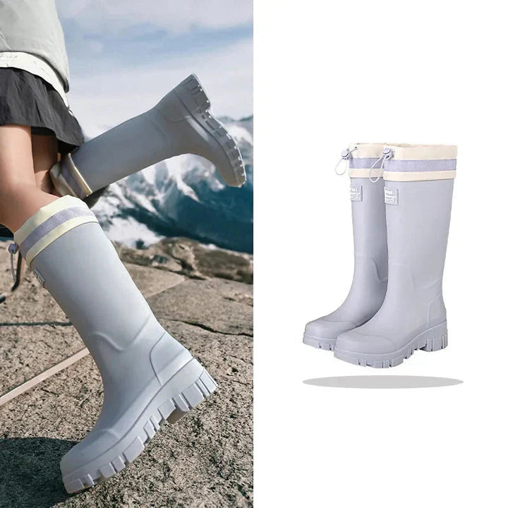 Mid-high waterproof women's rain boots, perfect casual comfort footwear for wet outdoor days.