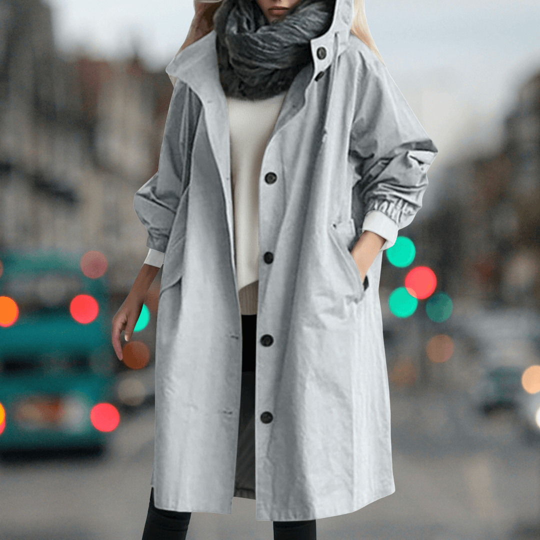 Cozy women's waterproof teddy lined trench coat, offering warmth and rain protection for cold seasons.