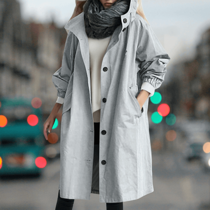 Cozy women's waterproof teddy lined trench coat, offering warmth and rain protection for cold seasons.