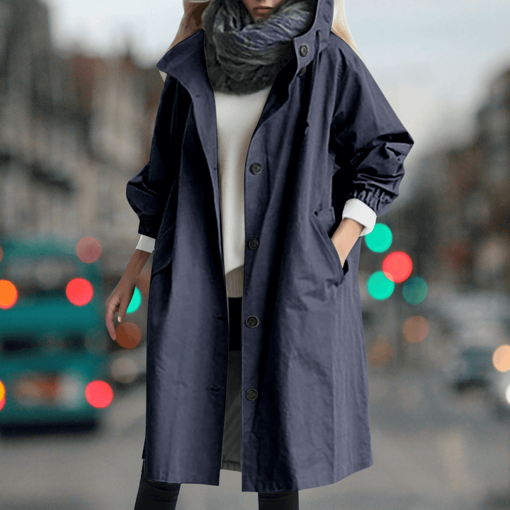Elegant women's waterproof trench coat with teddy lining, a warm and stylish outerwear piece for women.