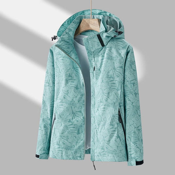 Durable women's waterproof windproof jacket for hiking & travel, ensures protection in all weather.