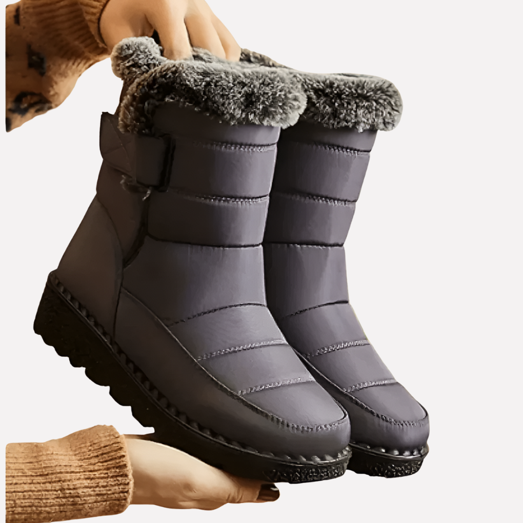 Warm women's snow boots, waterproof and non-slip, providing superior traction and comfort for winter adventures.