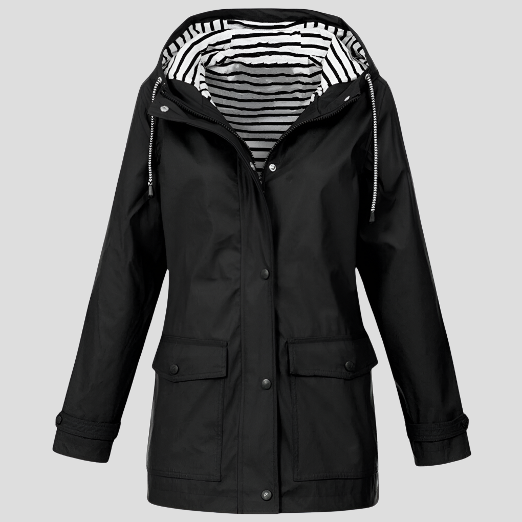 Lightweight women's hooded rain jacket, side view, showing weatherproof design for active outdoor autumn travel.