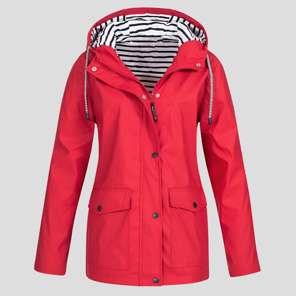 Woman hiking in a lightweight women's weatherproof hooded jacket, perfect activewear for spring outdoor activities.