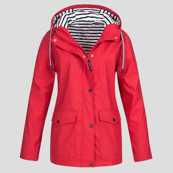 Woman hiking in a lightweight women's weatherproof hooded jacket, perfect activewear for spring outdoor activities.