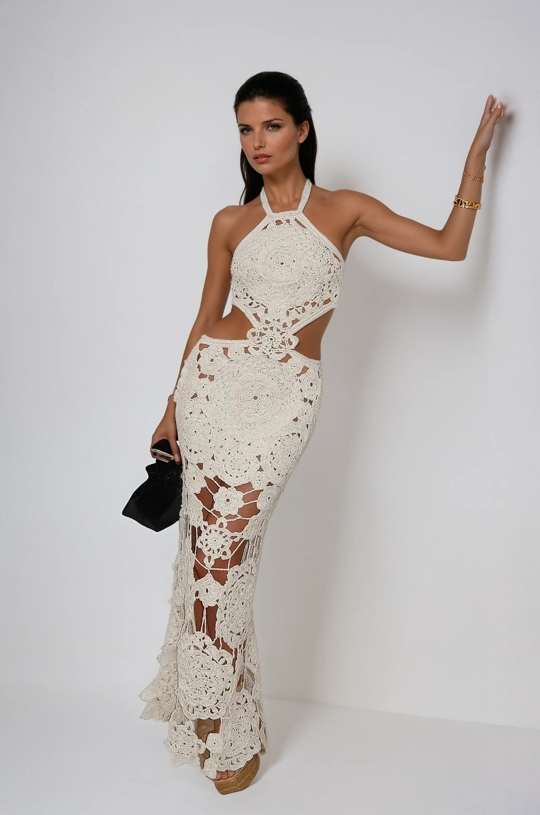 Women's white intricate cut out maxi dress for summer parties. Elegant resort wear.