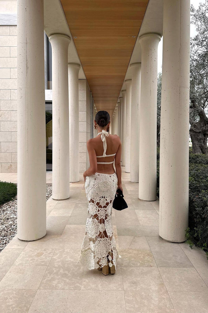 Boho chic white maxi dress for women, featuring intricate cut outs & open back. Perfect for summer beach parties.