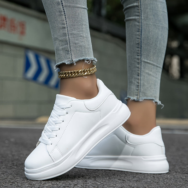 Comfortable women's white walking sneakers, designed for everyday wear, versatile style & ultimate support.