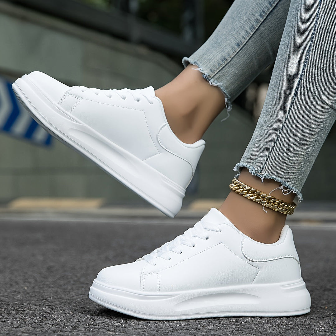 Pair of new women's white sneakers, ready for effortless style, comfort, and versatile everyday wear.
