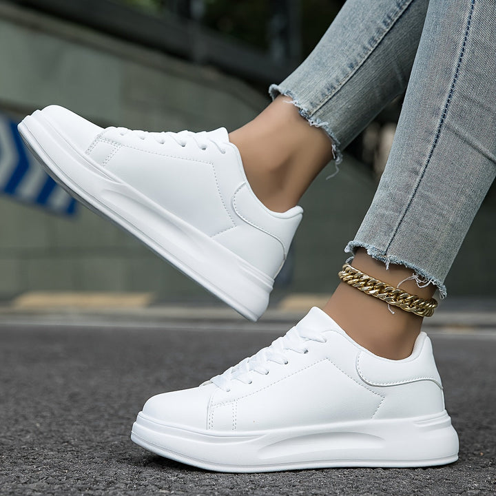 Pair of new women's white sneakers, ready for effortless style, comfort, and versatile everyday wear.