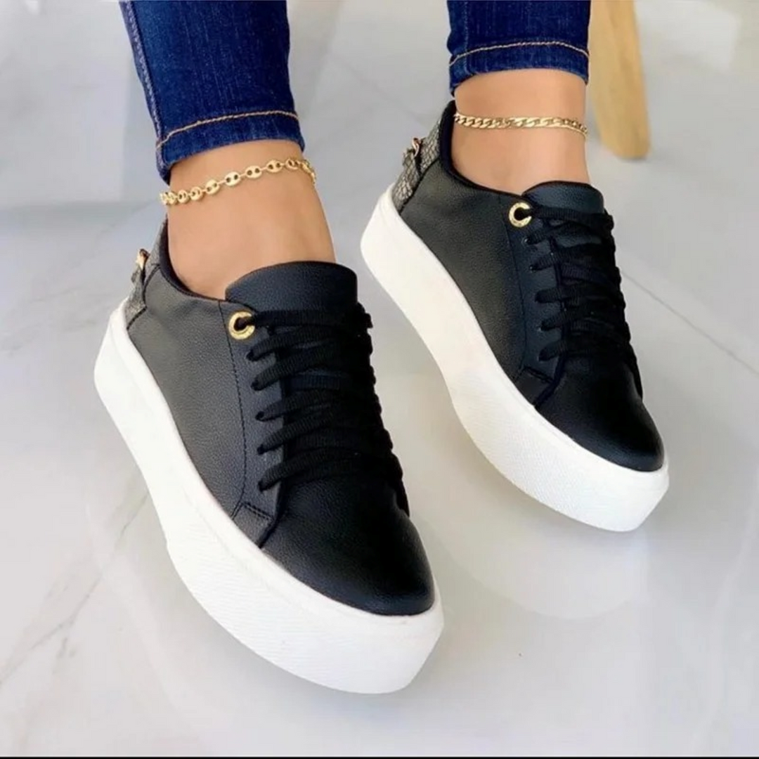ComfortStep women's modern white leather sneakers with a unique metallic chain for casual fashion.