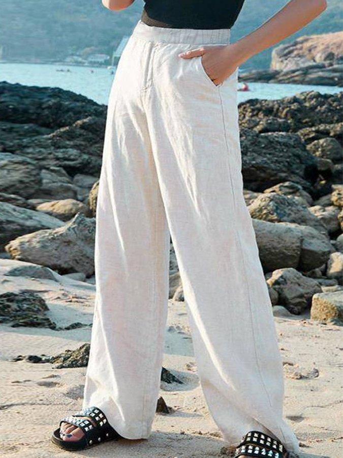 Loose-fit women's off-white linen blend pants with an elastic waist, ideal for lightweight, comfortable summer wear.