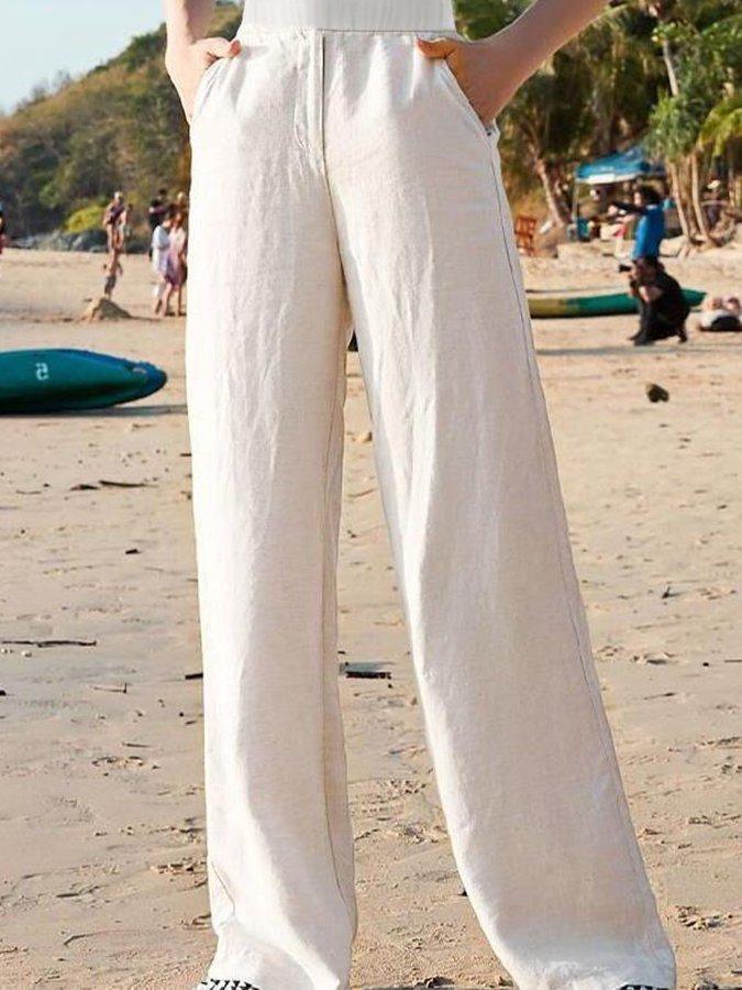 Comfortable women's white linen blend wide-leg trousers, featuring a loose fit and lightweight fabric for summer style.
