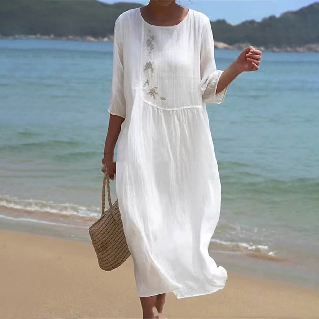 Women's white maxi dress for effortless summer elegance. Perfect for beach, vacation, or resort wear.