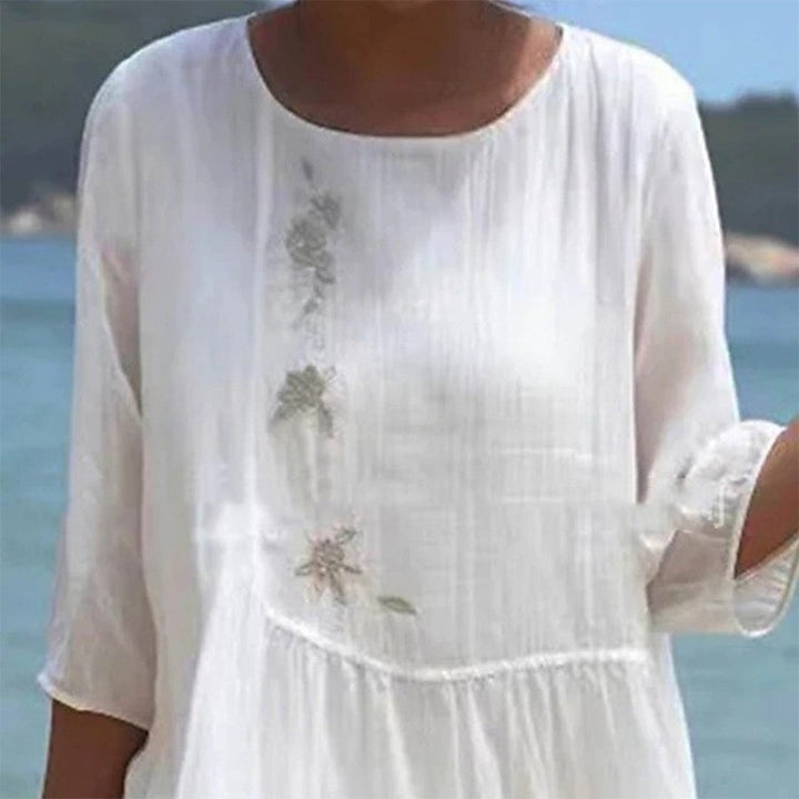 Elegant white maxi dress for women, featuring flowing fabric, comfortable fit, ideal for summer fashion & casual wear.