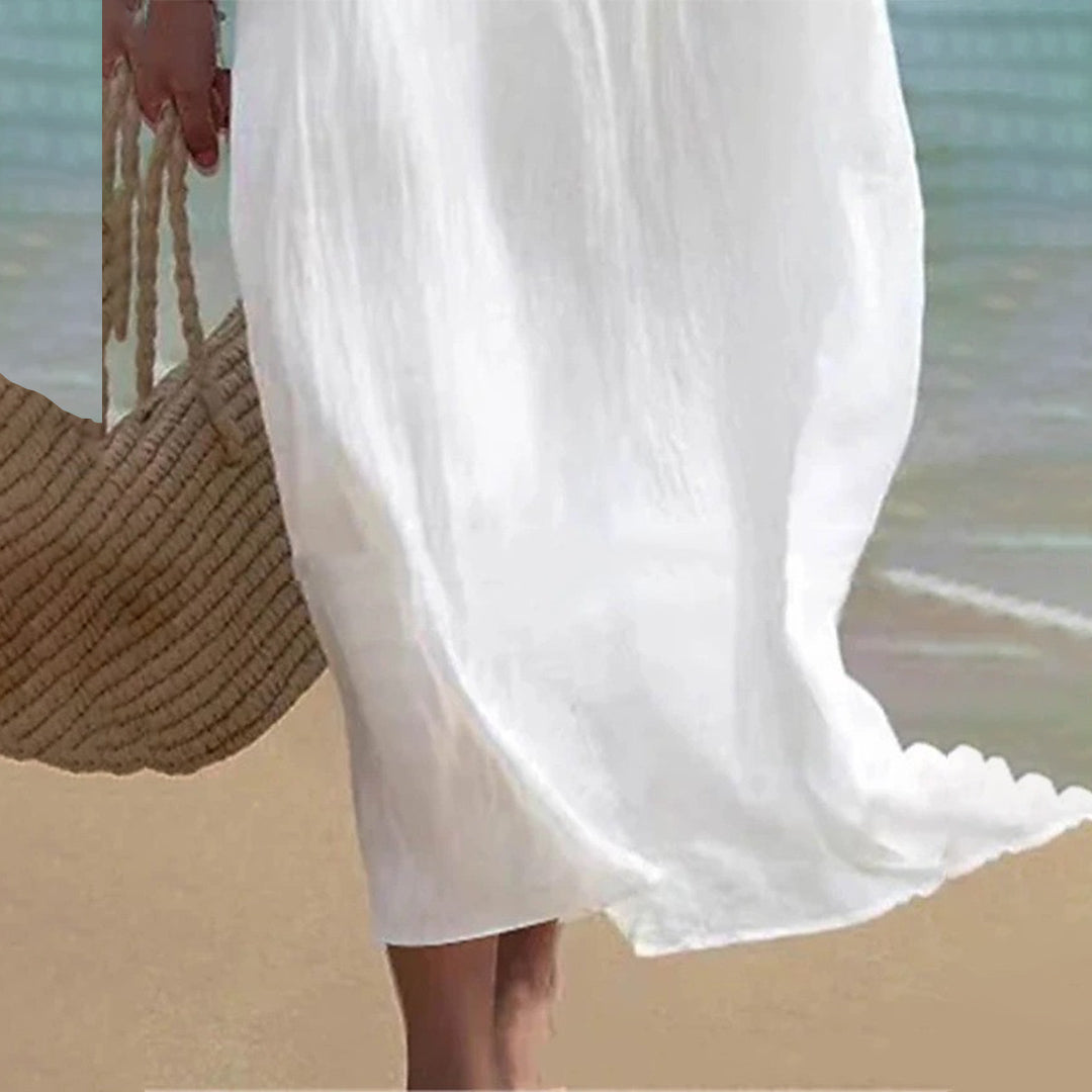 Feminine white maxi dress; a versatile summer dress for women, suitable for elegant events, beach, or resort.