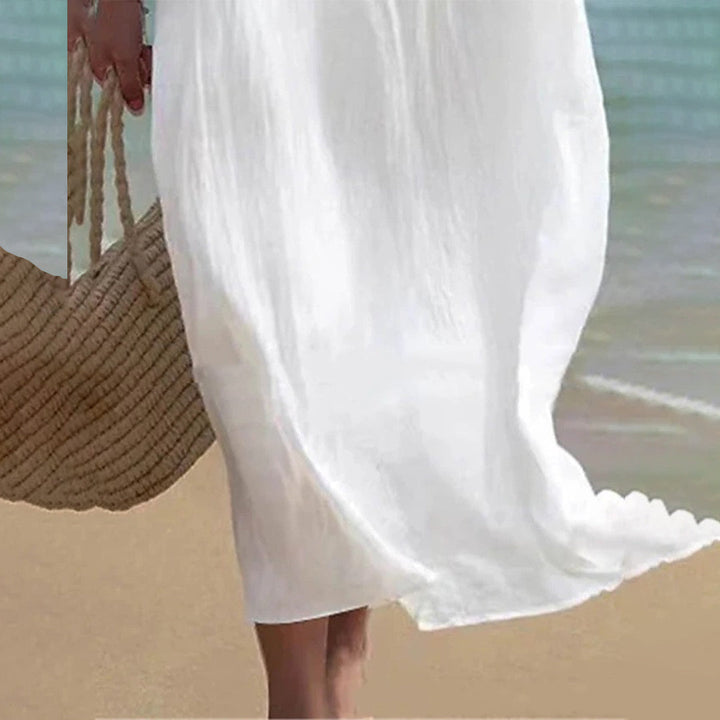 Feminine white maxi dress; a versatile summer dress for women, suitable for elegant events, beach, or resort.