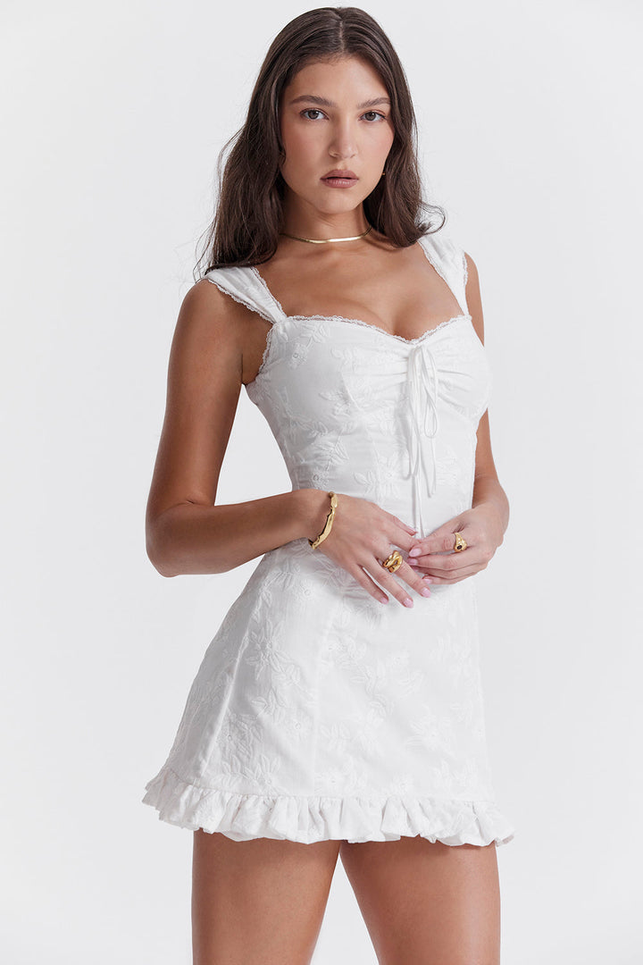Short white summer dress for women with a flattering tie waist. Stylish, elegant, and comfortable.