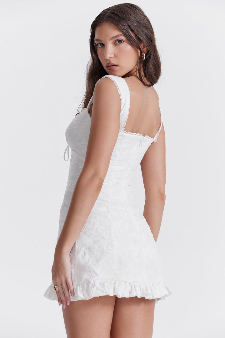 Casual women's white mini dress with tie waist, ideal for summer beach style or party fashion.