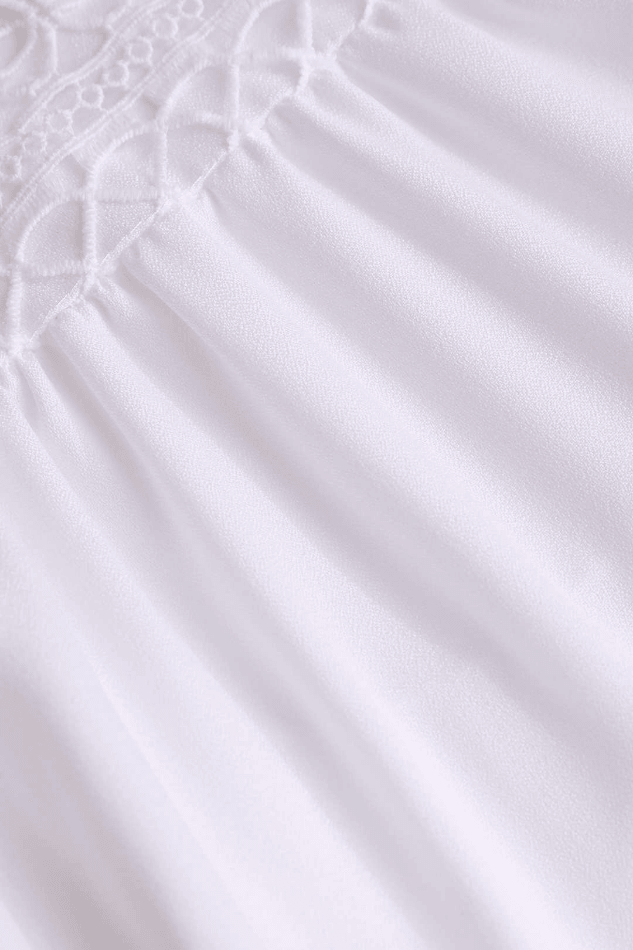 Effortless white V-neck mini dress for women, featuring a playful ruffle design; great for summer casual or evening.