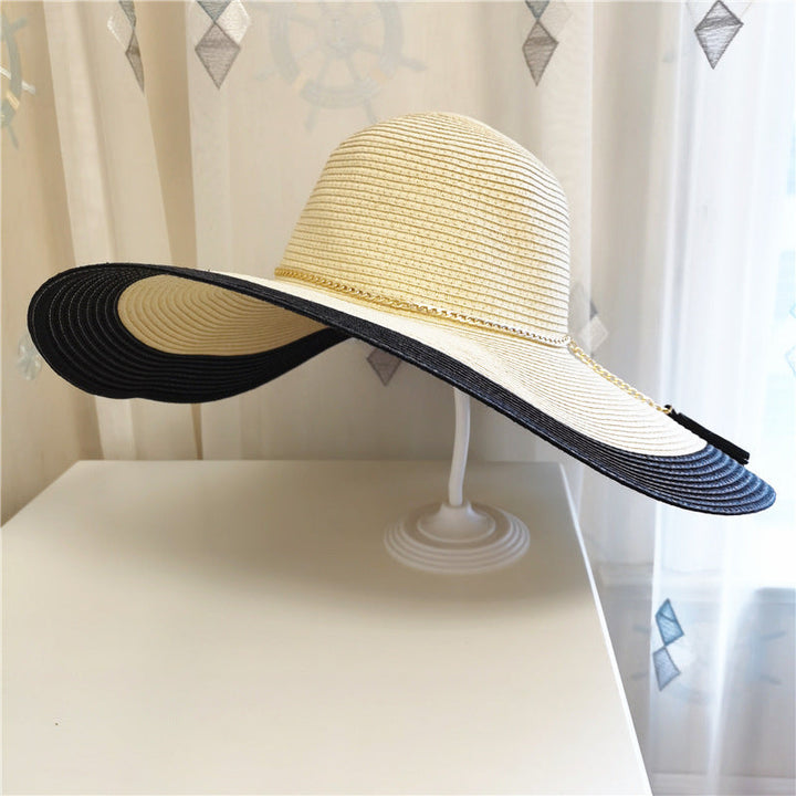 Lily women's wide brim sun hat with UV protection, essential for stylish sun safety on the beach.