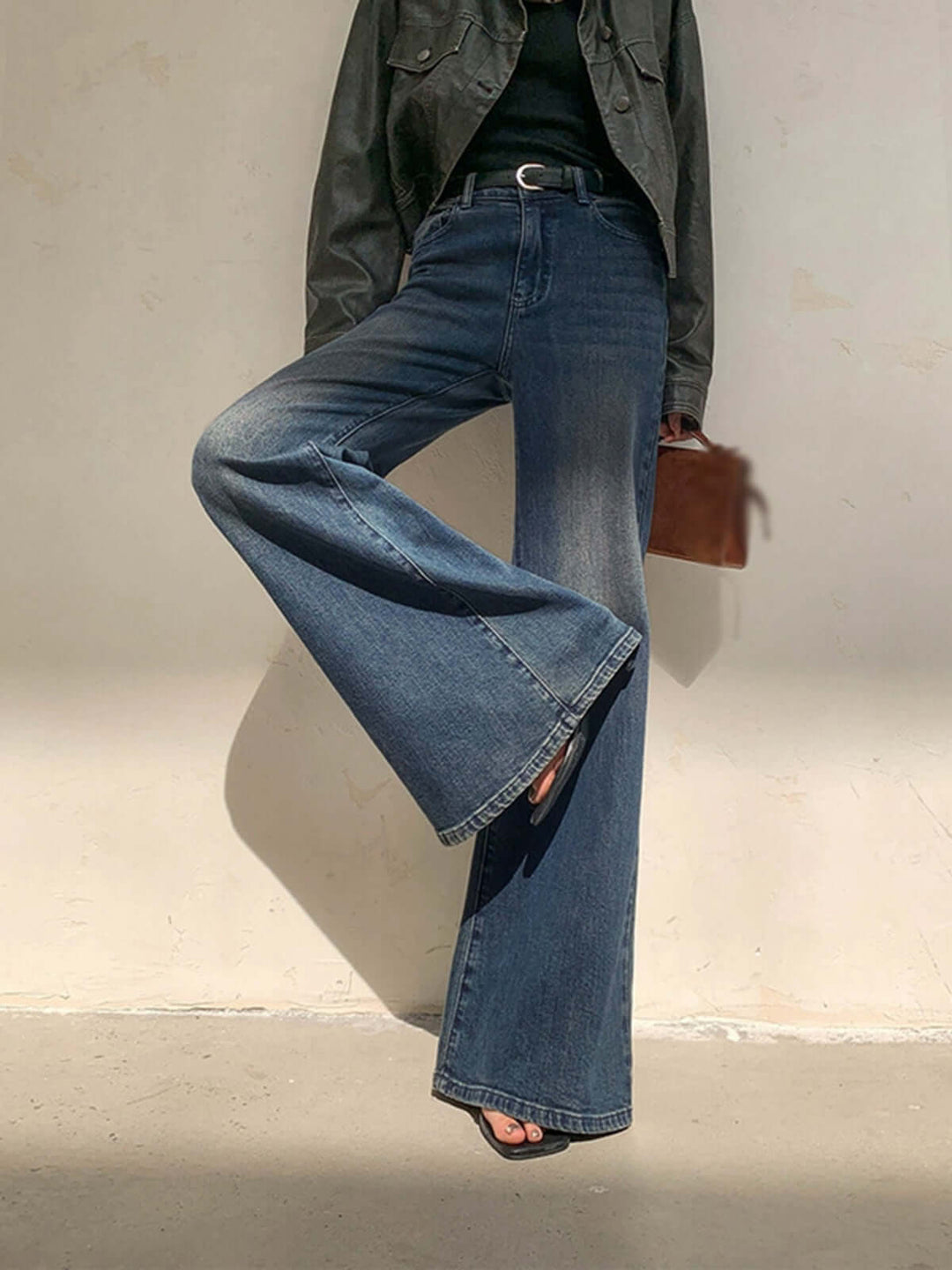 Blue vintage wide leg jeans for women. High-waisted design offers a flattering fit for spring & fall fashion.