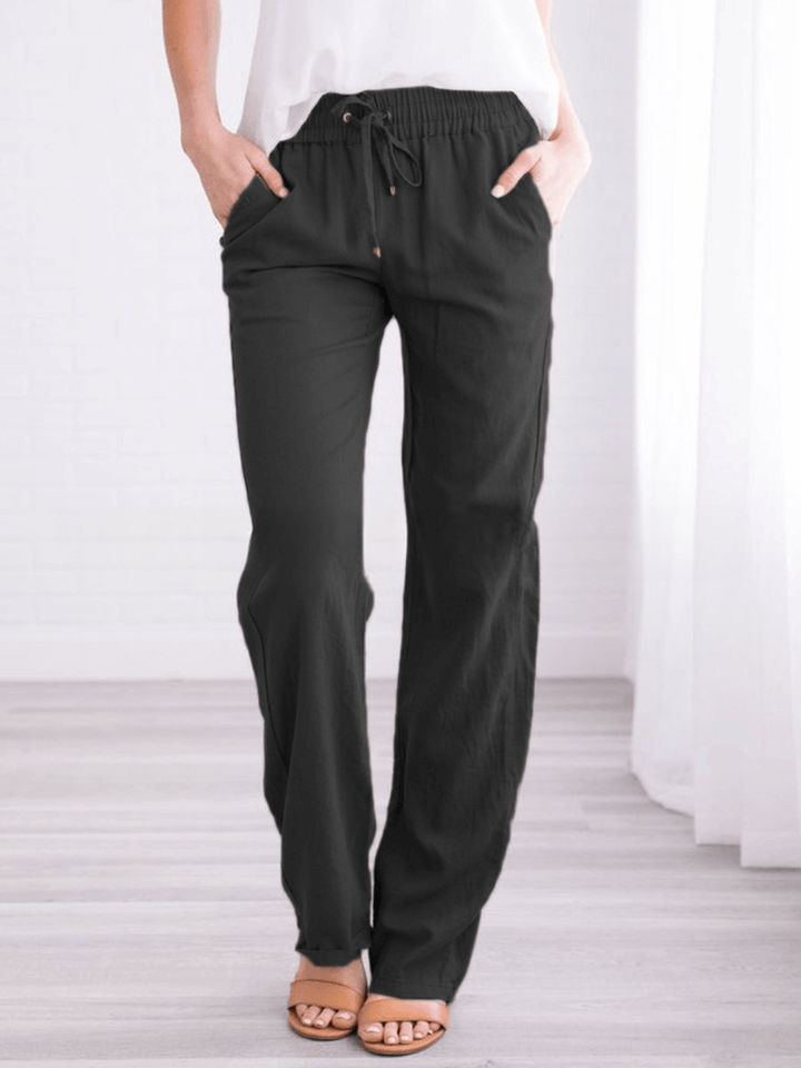 Side view: Women's stylish wide-leg drawstring pants in a soft, breathable linen-cotton blend.