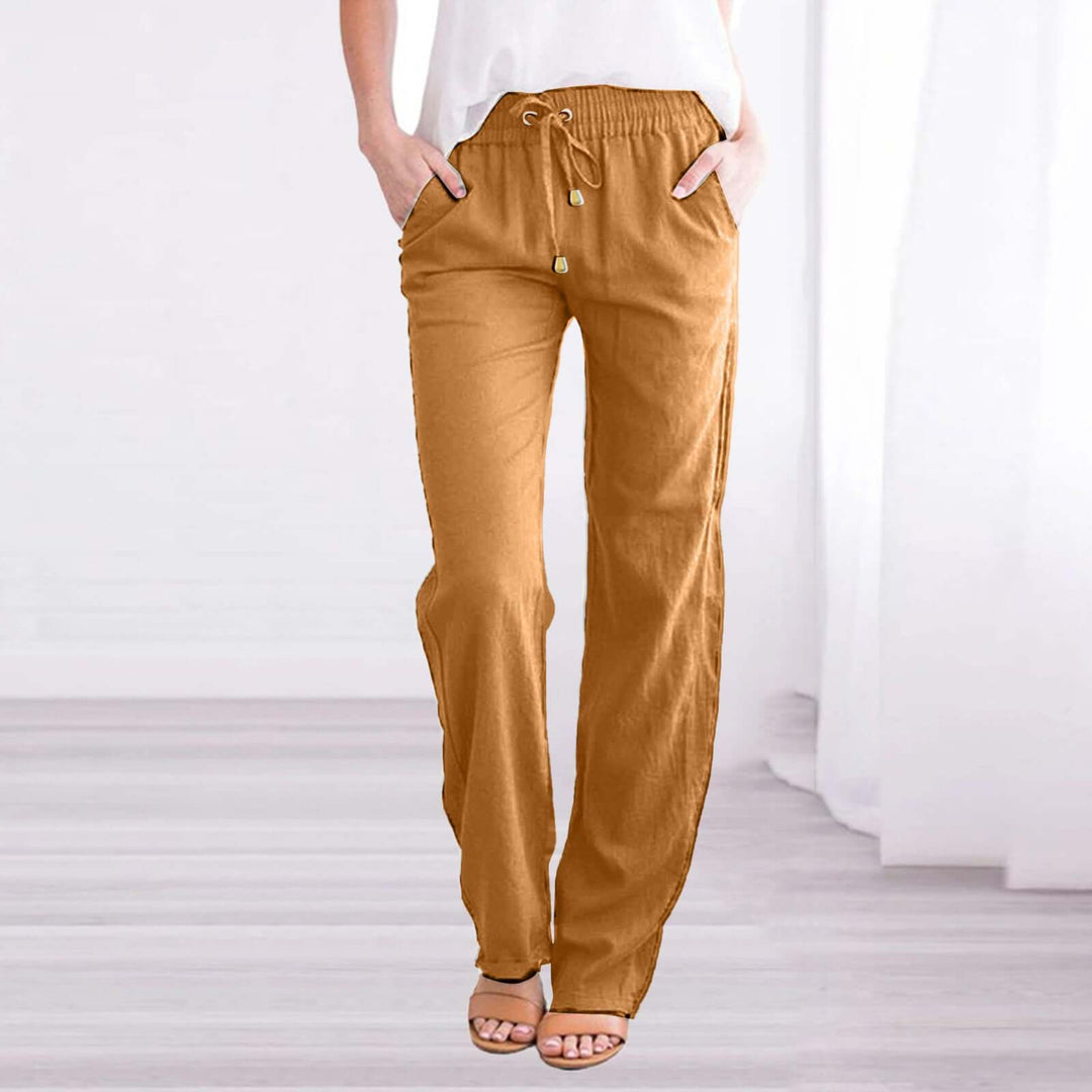 Women's linen-cotton wide-leg drawstring pants styled casually, perfect for a relaxed spring day.