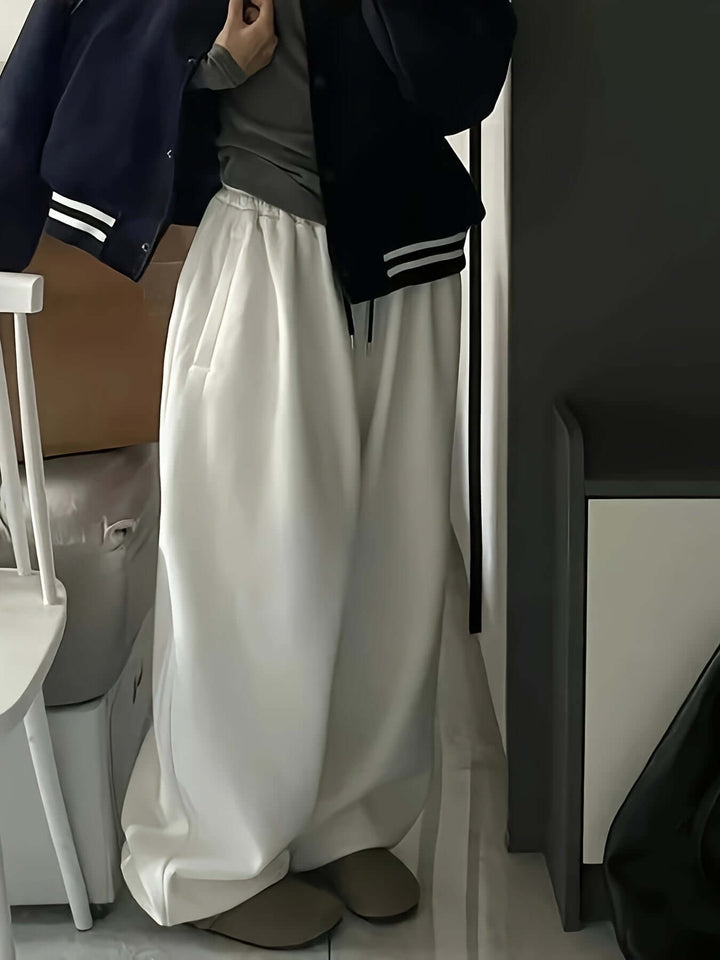 Elegant wide-leg women's sweatpants, elastic waist, offering a relaxed yet chic casual look.