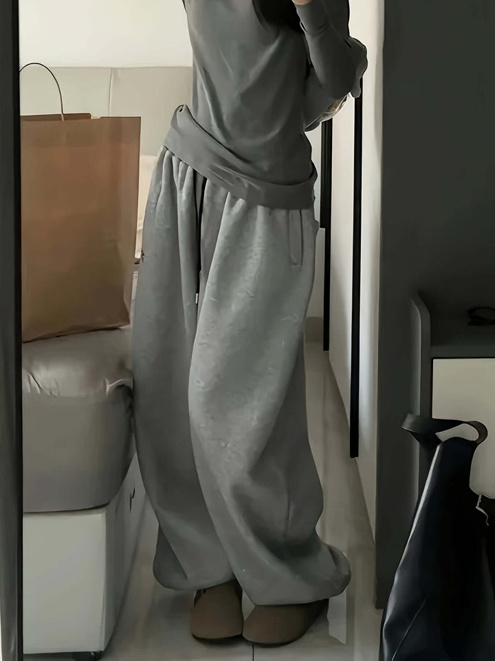 Women's comfortable wide-leg sweatpants with elastic waist, essential for casual & loungewear.