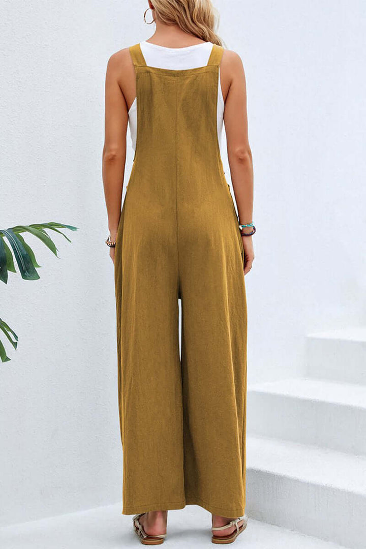 Full-length women's jumpsuit, wide neck, spaghetti straps, comfortable for daily wear.