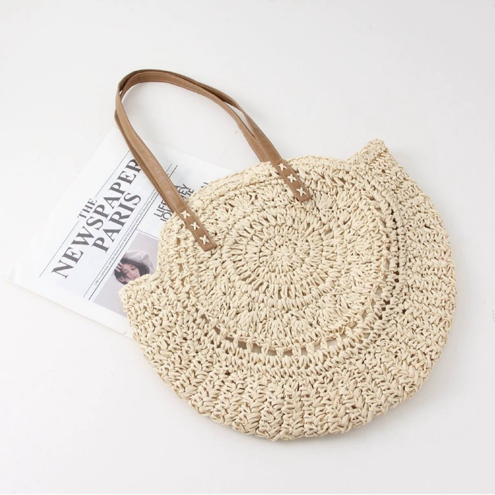 Women's woven round beach tote bag, perfect for summer fashion & resort wear. Stylish everyday shoulder bag.