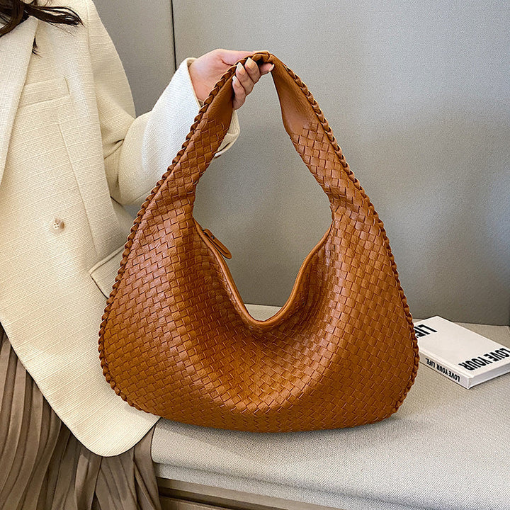 Women's woven shoulder bag, perfect for everyday carry & a stylish accessory.