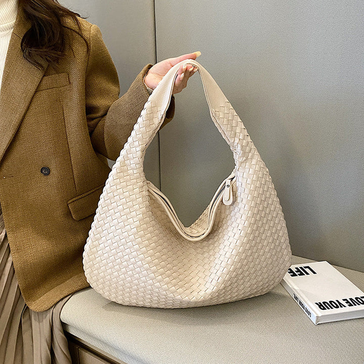 Chic women's woven shoulder bag, a versatile fashion accessory for everyday & office use.