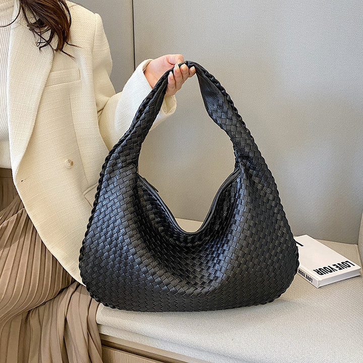 Versatile woven handbag for women, a stylish neutral-toned accessory for everyday fashion.