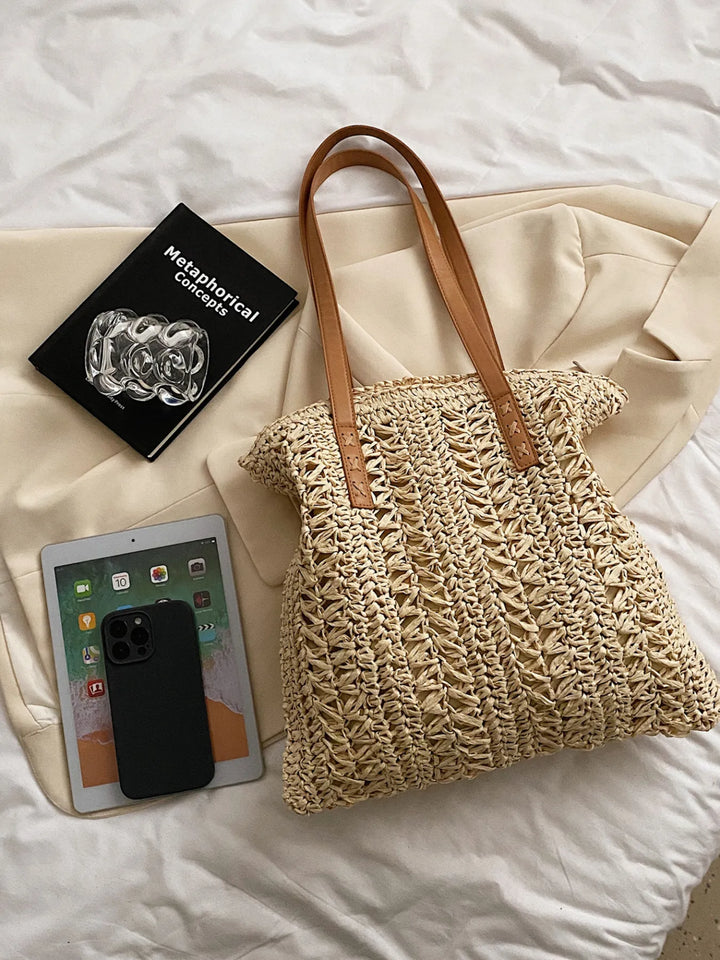 Women's woven straw summer shoulder bag, perfect as a lightweight beach tote or casual vacation bag.