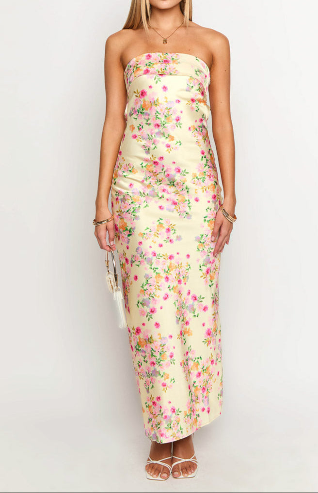 Flowy yellow floral strapless maxi dress. A beautiful choice for summer elegance.