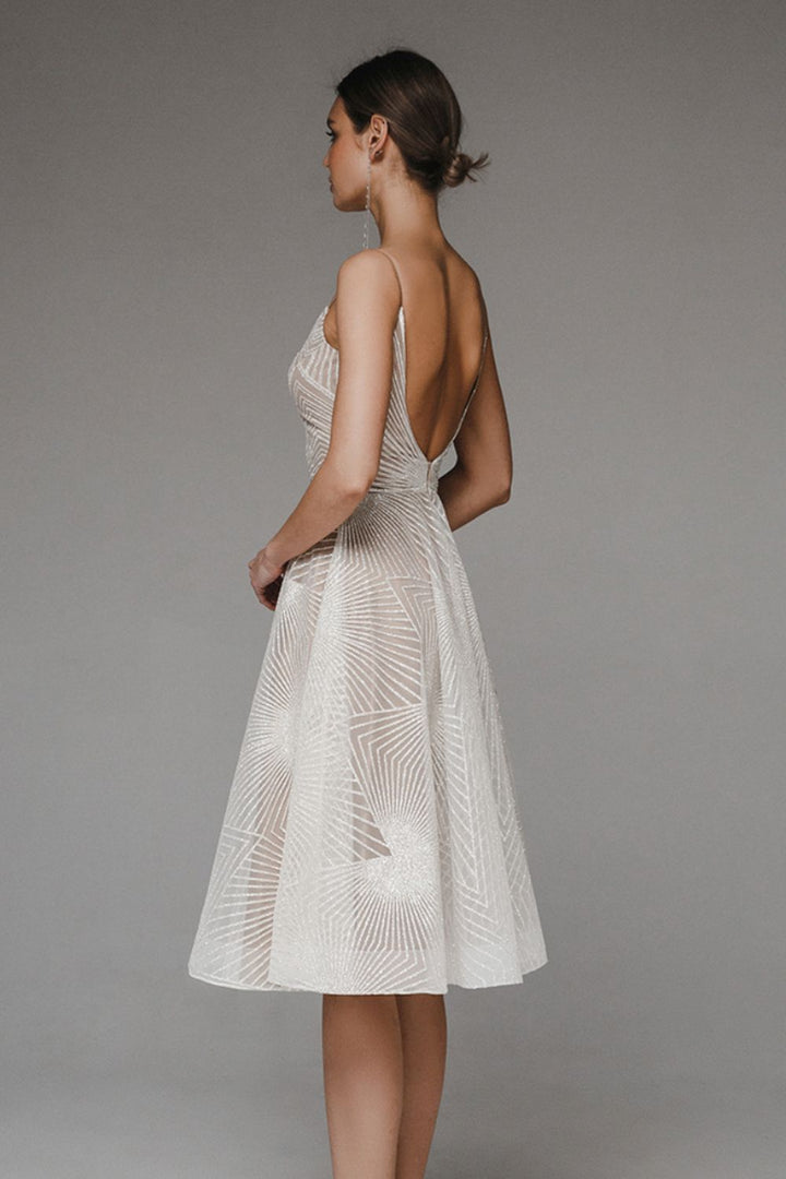 Women's A-Line evening dress with chiffon overlay, geometric pattern, and spaghetti straps, elegant for formal occasions.