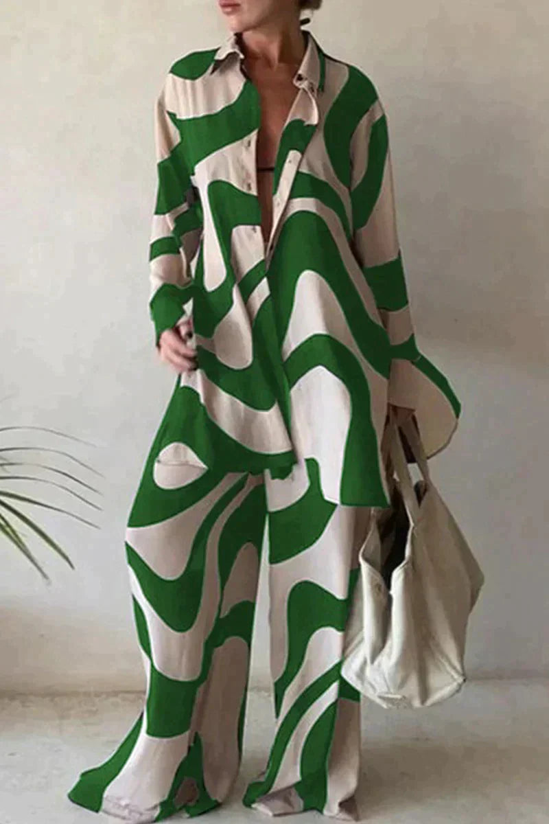 "Women's abstract printed 2-piece set with long-sleeve shirt and wide-leg pants, relaxed fit, bold pattern."