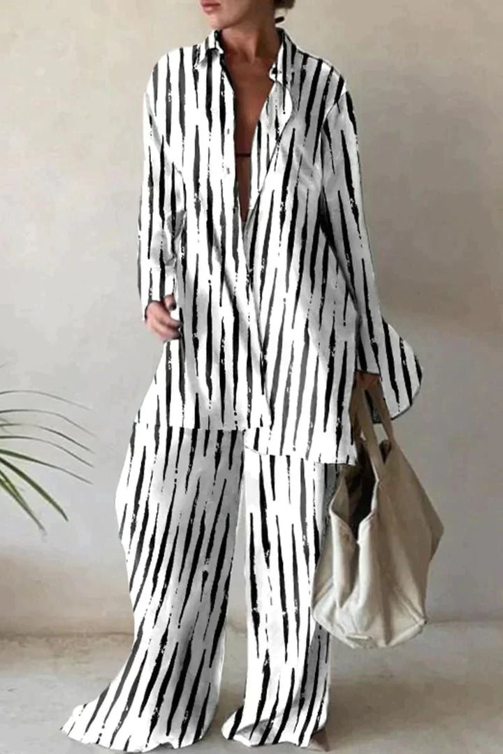 "Women's abstract printed 2-piece set with long-sleeve shirt and wide-leg pants, relaxed fit, bold pattern."