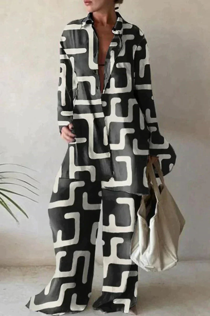 "Women's abstract printed 2-piece set with long-sleeve shirt and wide-leg pants, relaxed fit, bold pattern."