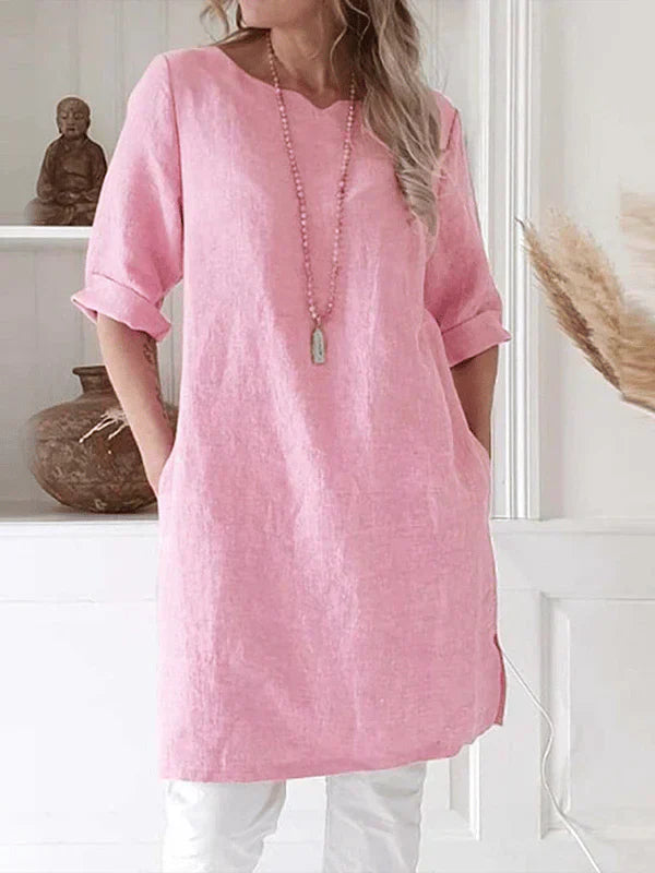 "Women's breathable linen tunic dress with relaxed fit and rolled 3/4 sleeves, featuring soft fabric for stylish comfort."