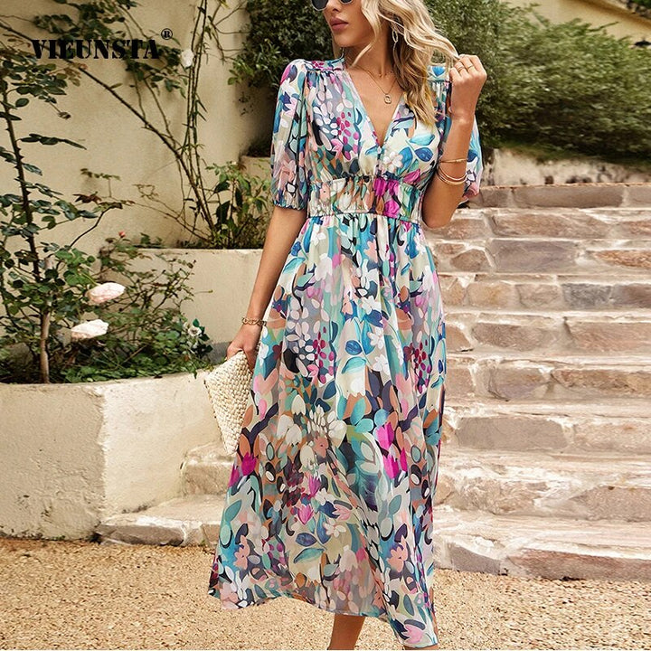 "Women's casual V-neck midi dress in breathable cotton, features short sleeves and a relaxed silhouette for summer comfort."