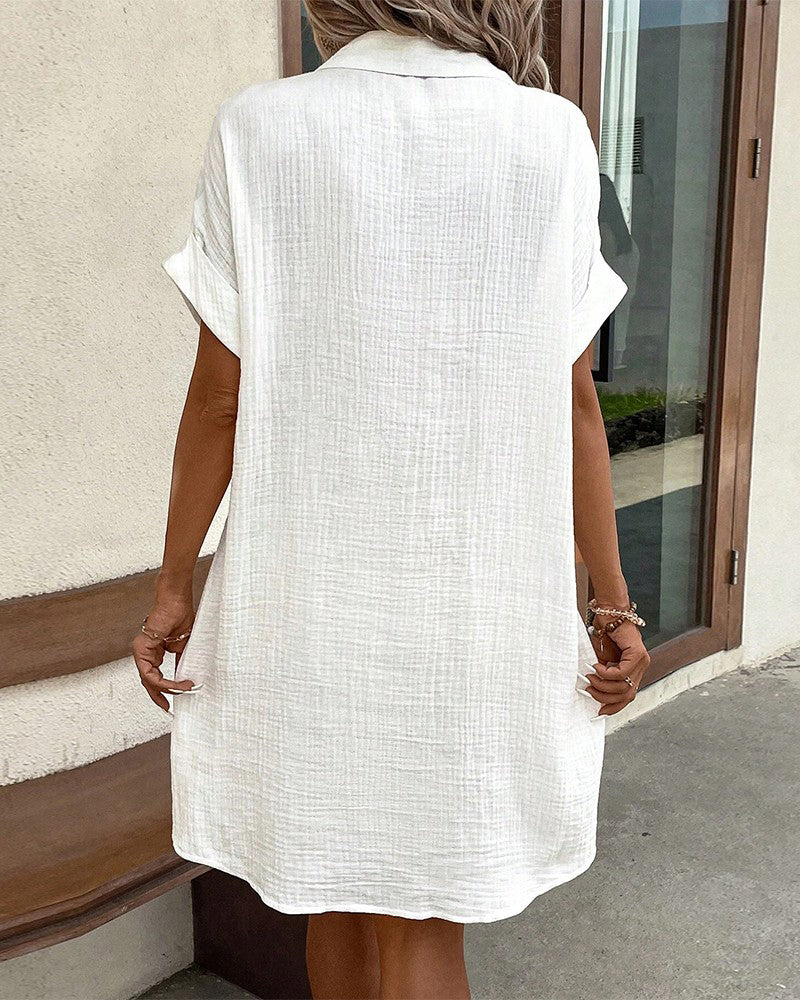 "Women's cotton blend shirt dress with button-down front, short sleeves, and rolled cuffs for casual elegance - front view."