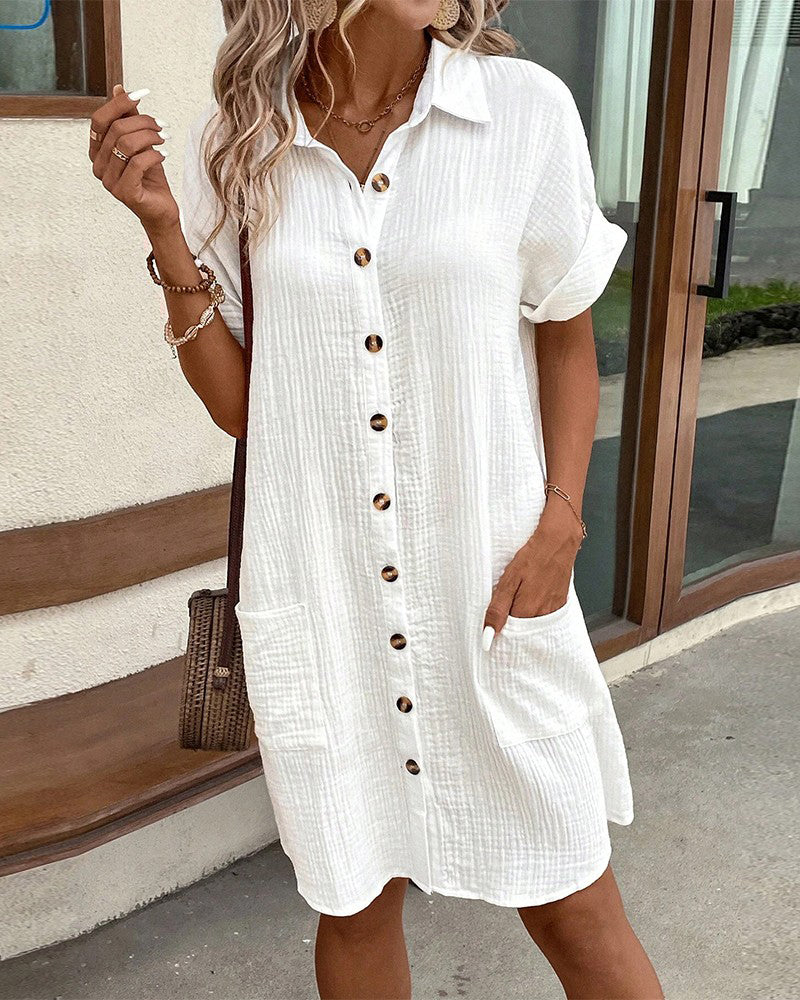 "Women's cotton blend shirt dress with button-down front, short sleeves, and rolled cuffs for casual elegance - front view."